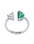 A negative space Toi et Moi ring with a half-moon-shaped natural Colombian emerald is handcrafted in 18k solid white gold.