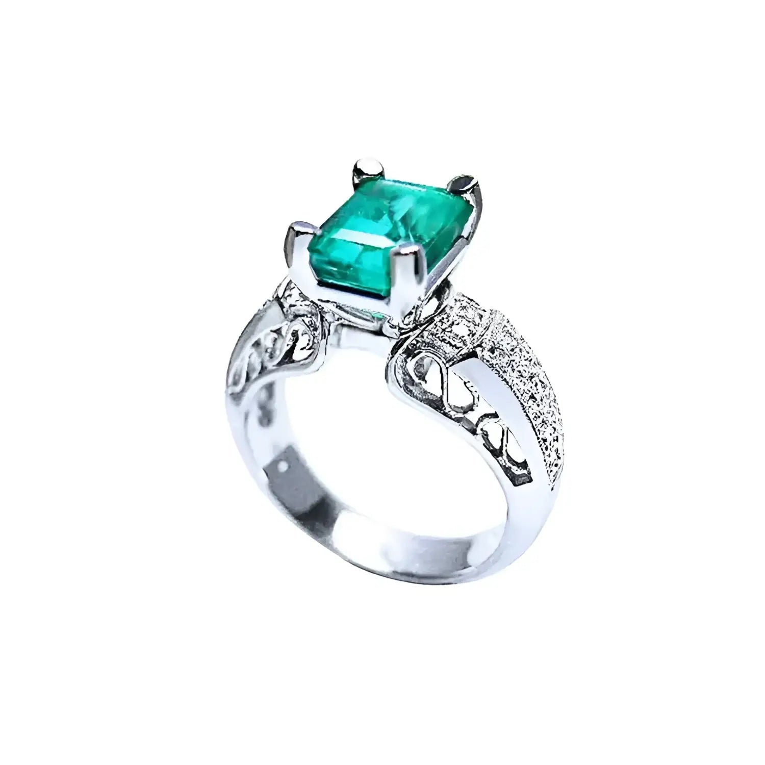 Anillo de oro blanco 18K con esmeralda colombiana rectangular verde profundo y diamantes, estilo antiguo.
