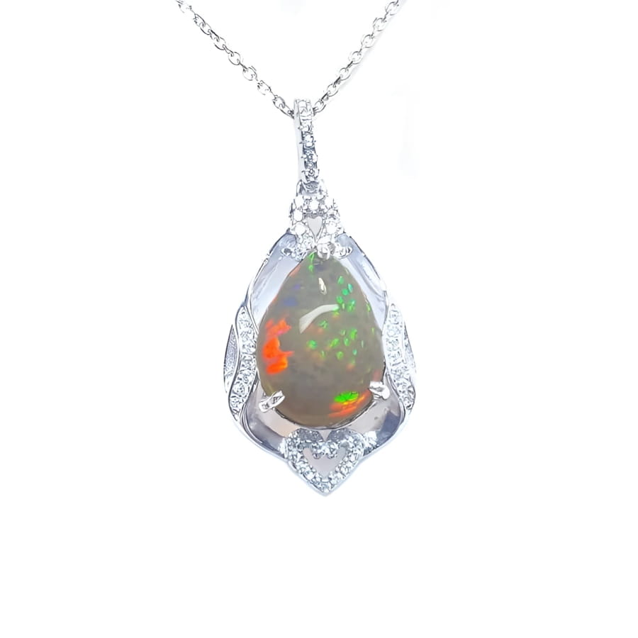 Pear-shaped rainbow Welo Ethiopian opal pendant in 925 sterling silver with cubic zirconia accents.