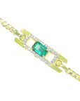 Gold bracelet with a colombian emeralds and diamonds on a topside view position.