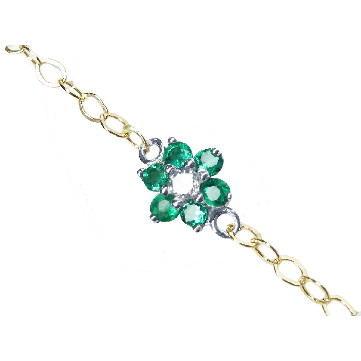Emerald cluster bracelet with center diamond, crafted in 14k white and yellow gold on a topside view.