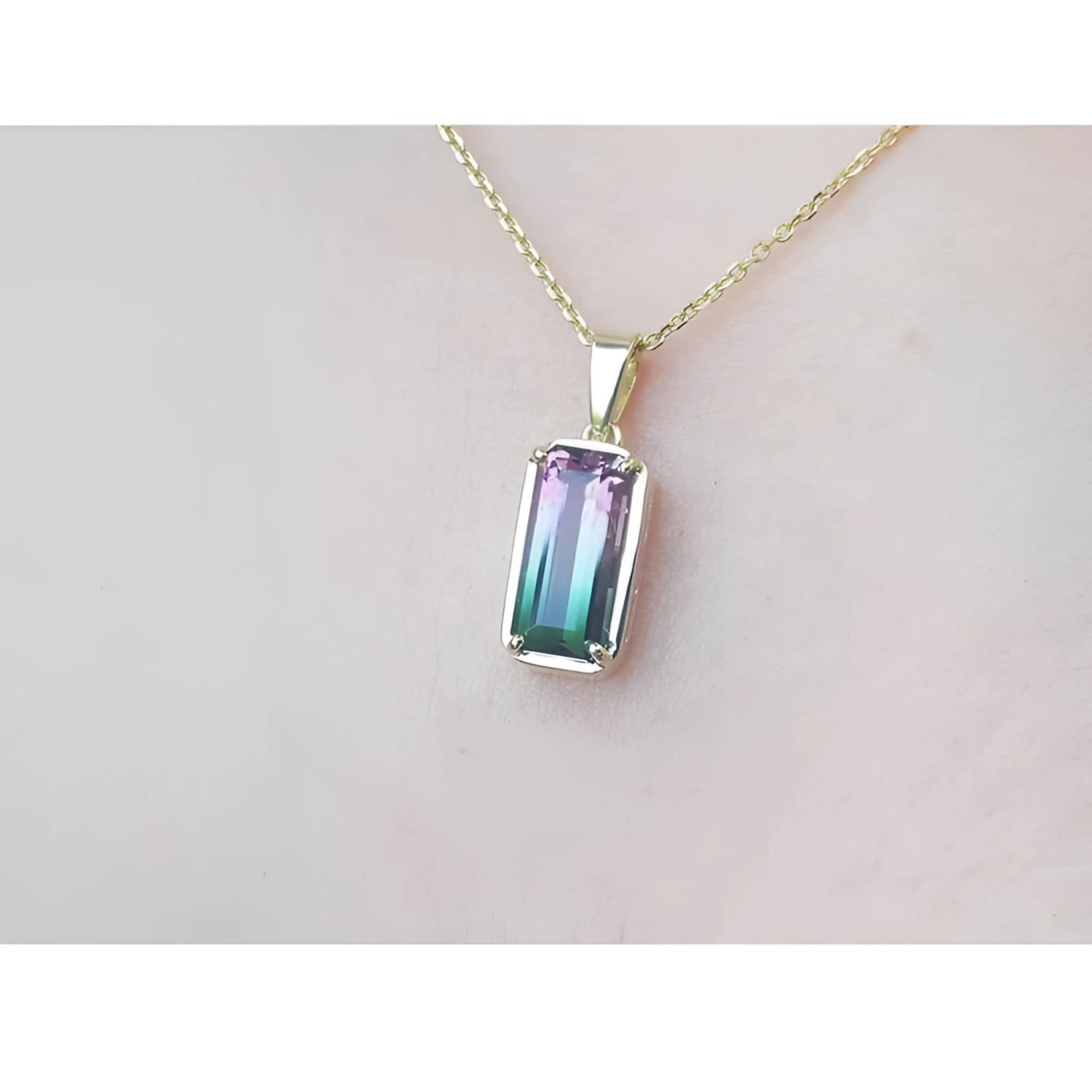 2.50 ct. watermelon tourmaline solitaire pendant with pink and blue-green hues in 14K yellow gold.