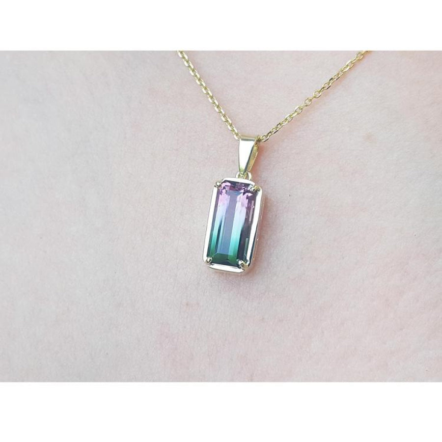 2.50 ct. watermelon tourmaline solitaire pendant with pink and blue-green hues in 14K yellow gold.