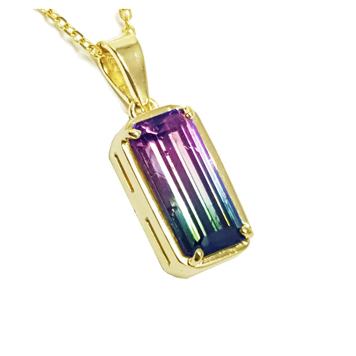 Gold pendant with a colorful watermelon tourmaline gemstone on a white background.