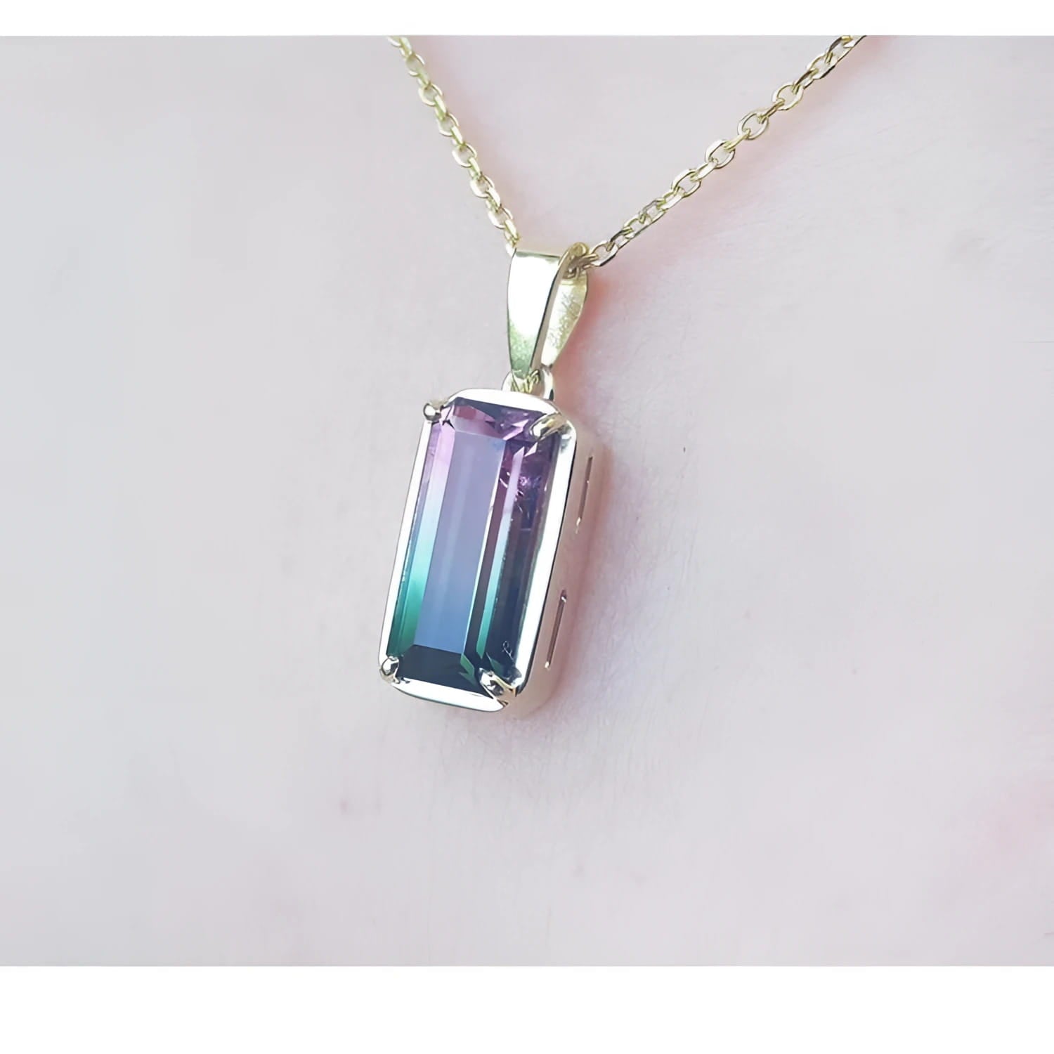 2.50 ct. watermelon tourmaline solitaire pendant with pink and blue-green hues in 14K yellow gold.
