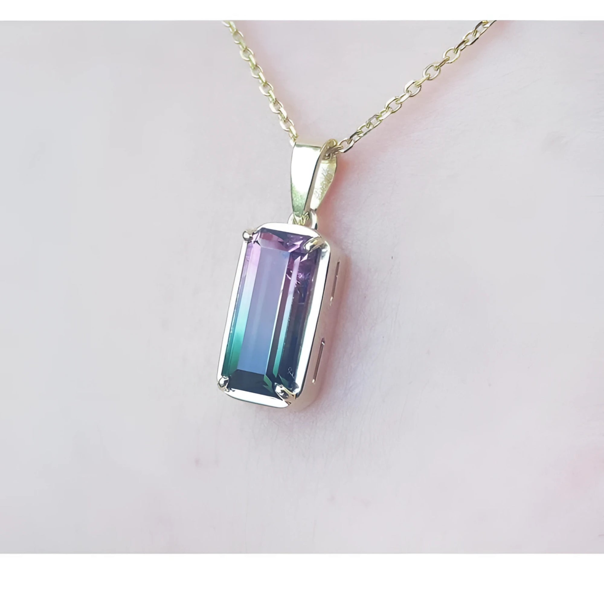 2.50 ct. watermelon tourmaline solitaire pendant with pink and blue-green hues in 14K yellow gold.