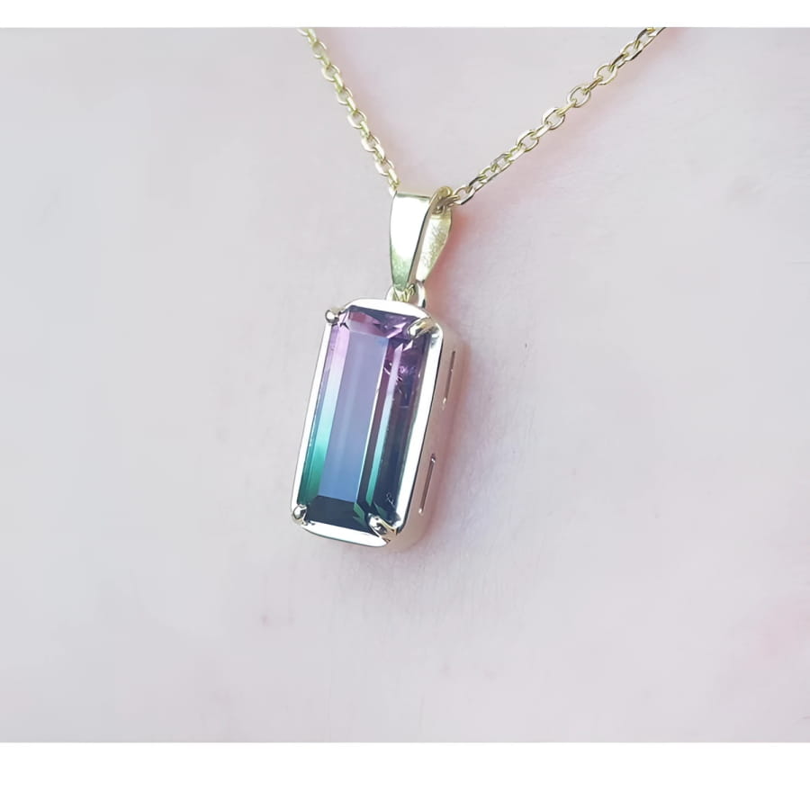 2.50 ct. watermelon tourmaline solitaire pendant with pink and blue-green hues in 14K yellow gold.