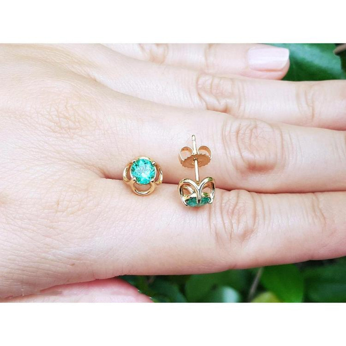 Colombian emerald tulip stud earrings in 14K yellow gold with secure push backs.