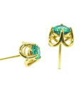 Yellow gold Tulip emerald stud earrings, underside profile view.