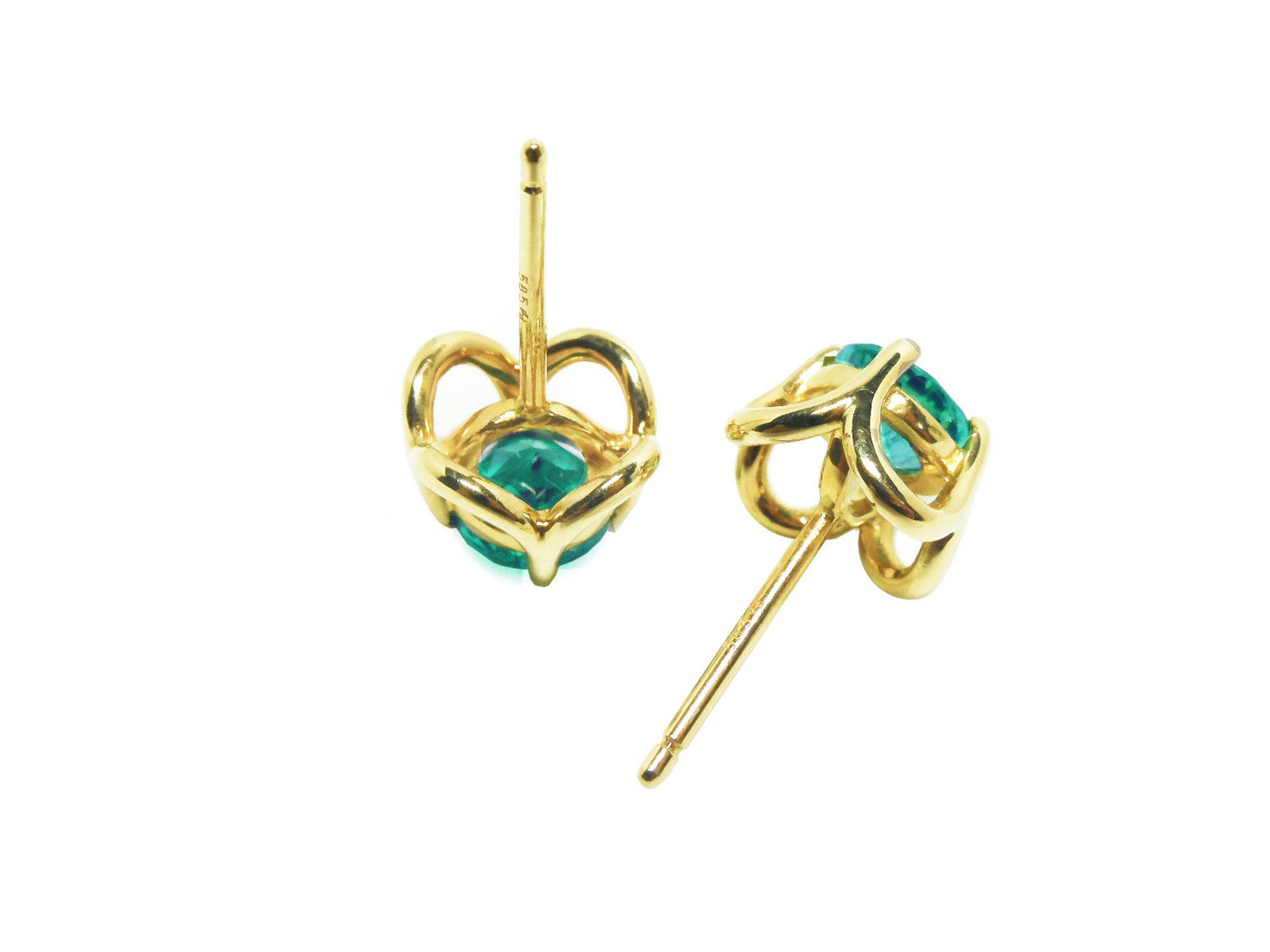 Upside down position of a pair of genuine tulip emerald stud earrings, underside view.