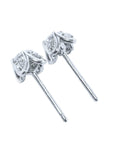 A pait of natural diamond tulip stud earrings in white gold, underside profile view.