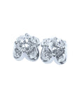 A pair of white gold diamond stud earrings with a round cut and tulip prong set style, featuring accent diamond petals.
