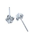 On upside down position a pair of natural diamond tulip stud earrings in white gold, underside profile view.