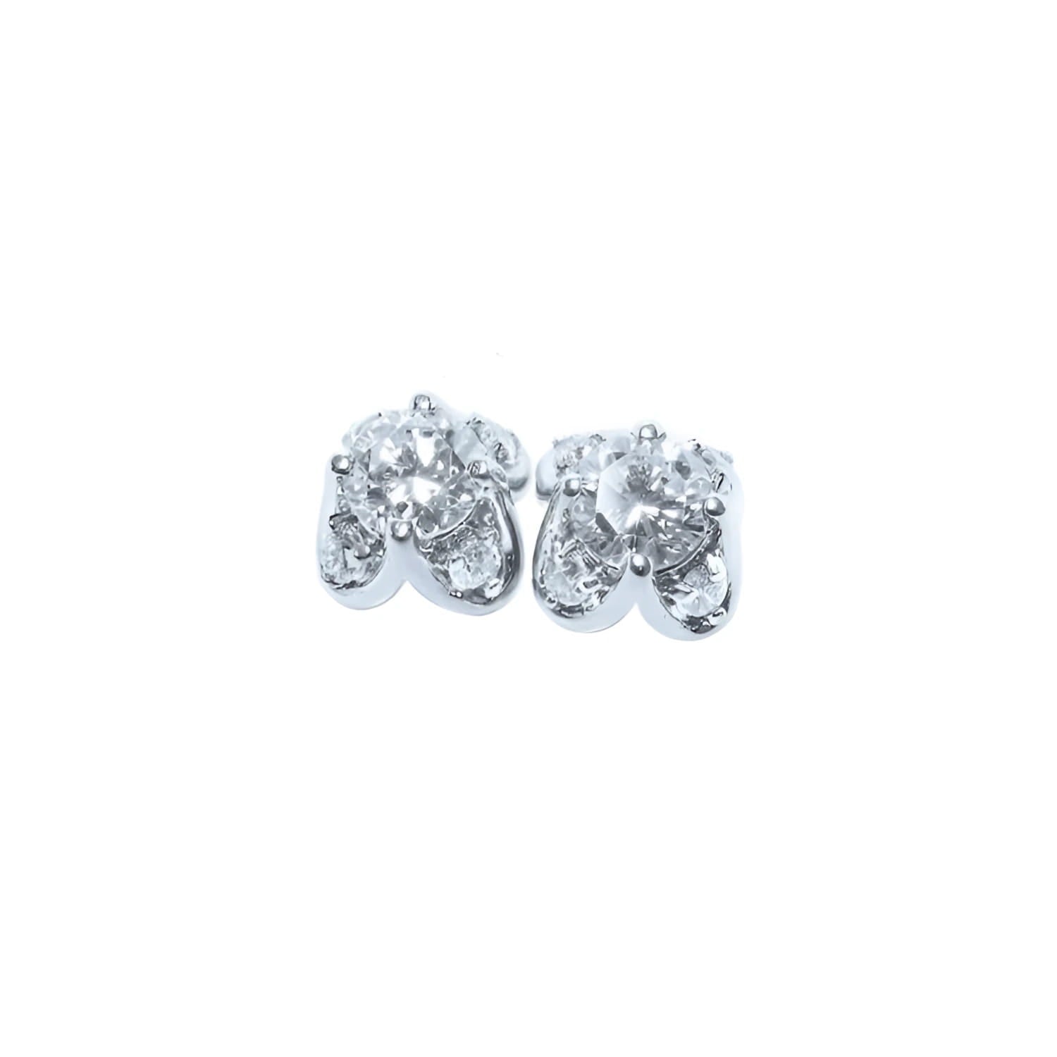 A pair of white gold diamond stud earrings with a round cut and tulip prong set style, featuring accent diamond petals.