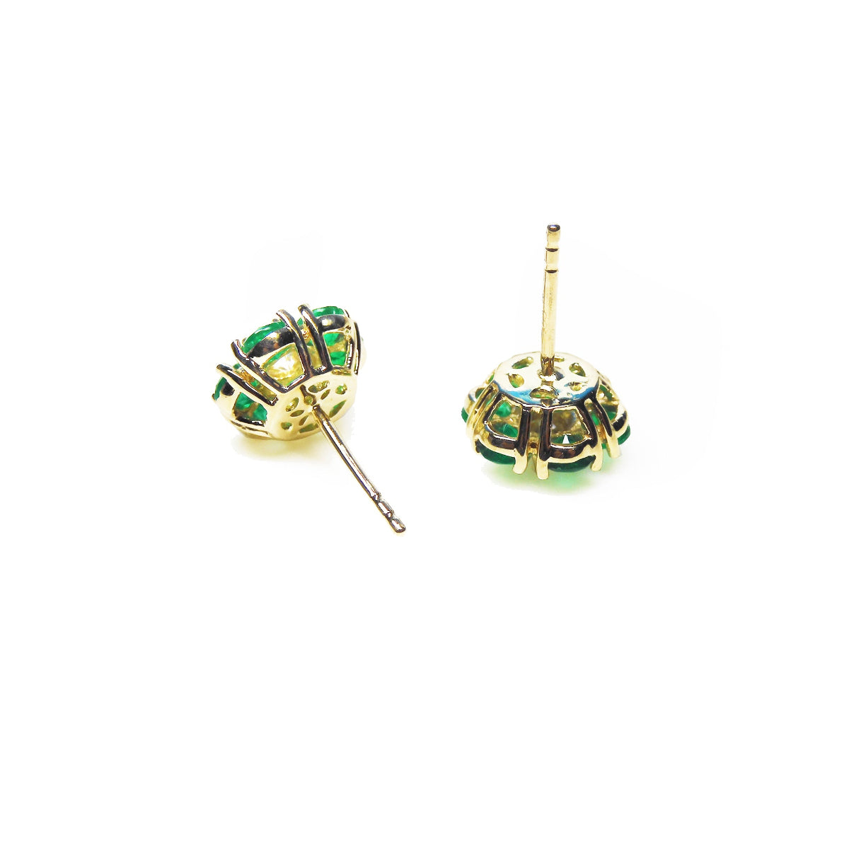 Gold cluster emerald earrings with center diamond in 18k gold, in underside view.