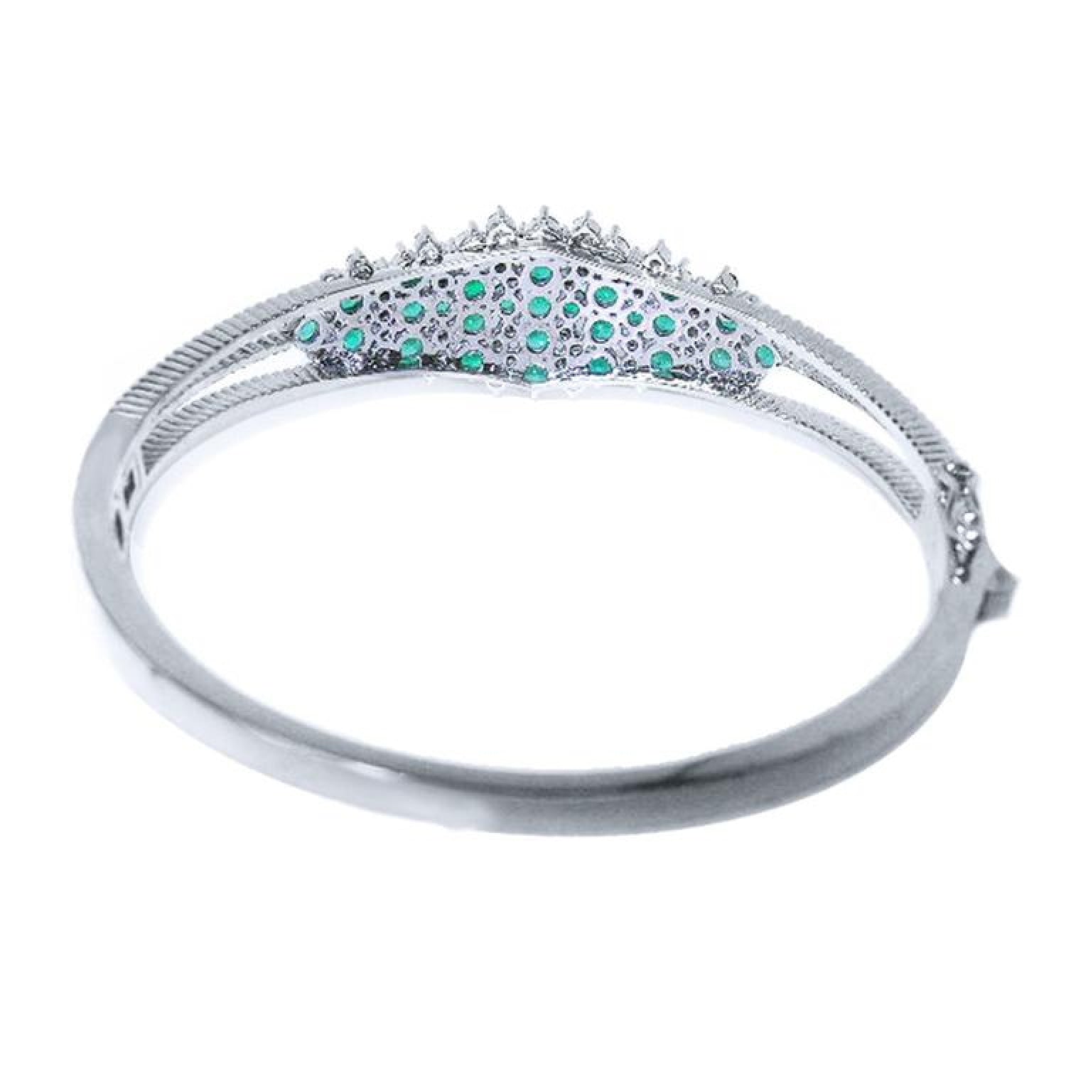14k white gold bangle bracelet with round Colombian emeralds and diamonds.