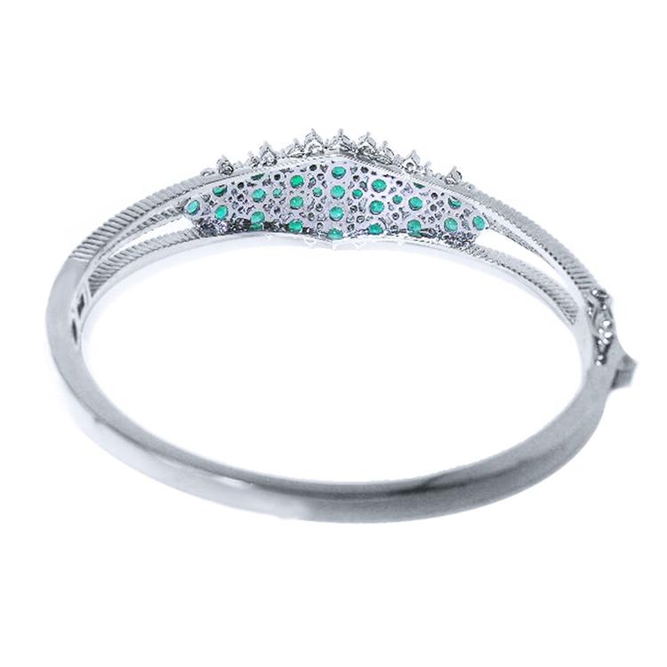 14k white gold bangle bracelet with round Colombian emeralds and diamonds.