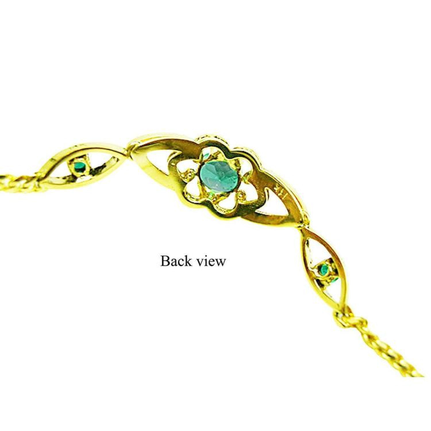 Back view of a 14K yellow gold bracelet with oval emeralds and a vintage flower design.