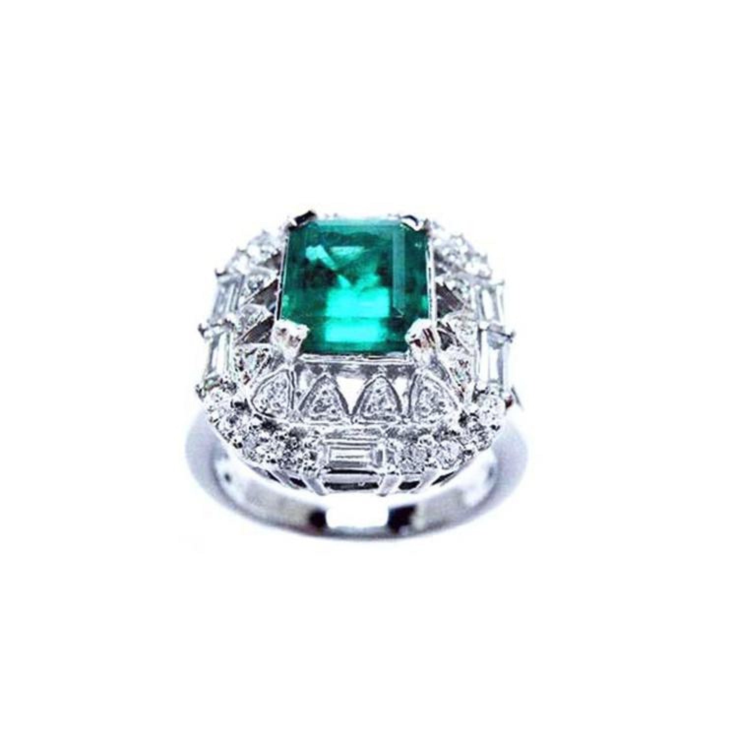 Vintage 2.40 ct Colombian emerald ring in 14K white gold with diamond accents.
