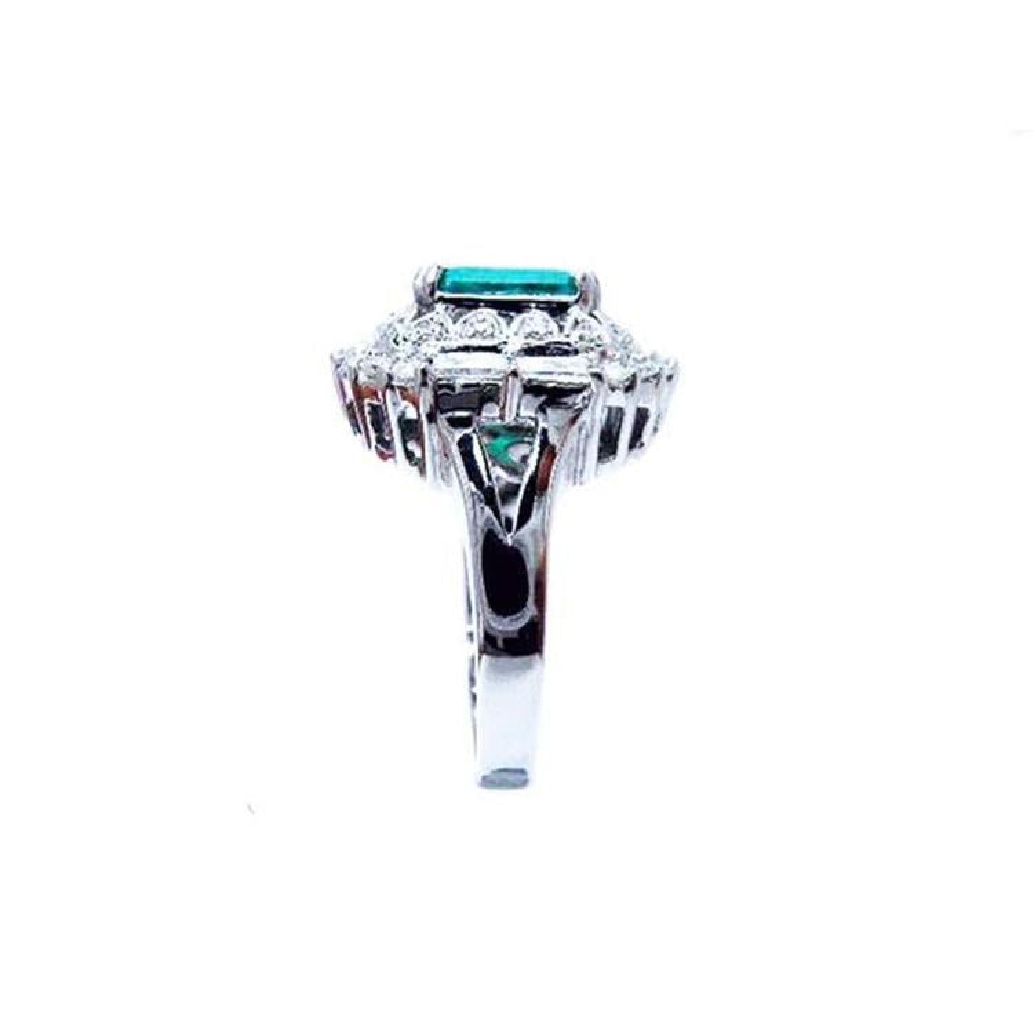 Vintage 14K white gold ring with a 2.40 ct bluish-green Colombian emerald and diamond accents.