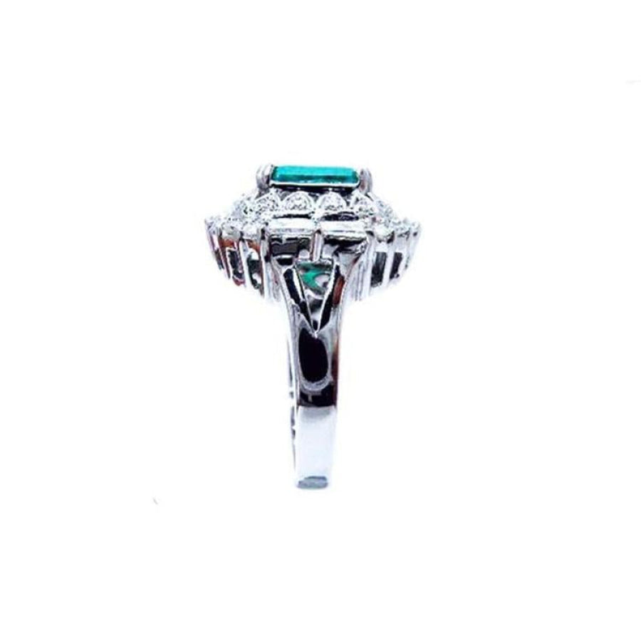 Vintage 14K white gold ring with a 2.40 ct bluish-green Colombian emerald and diamond accents.