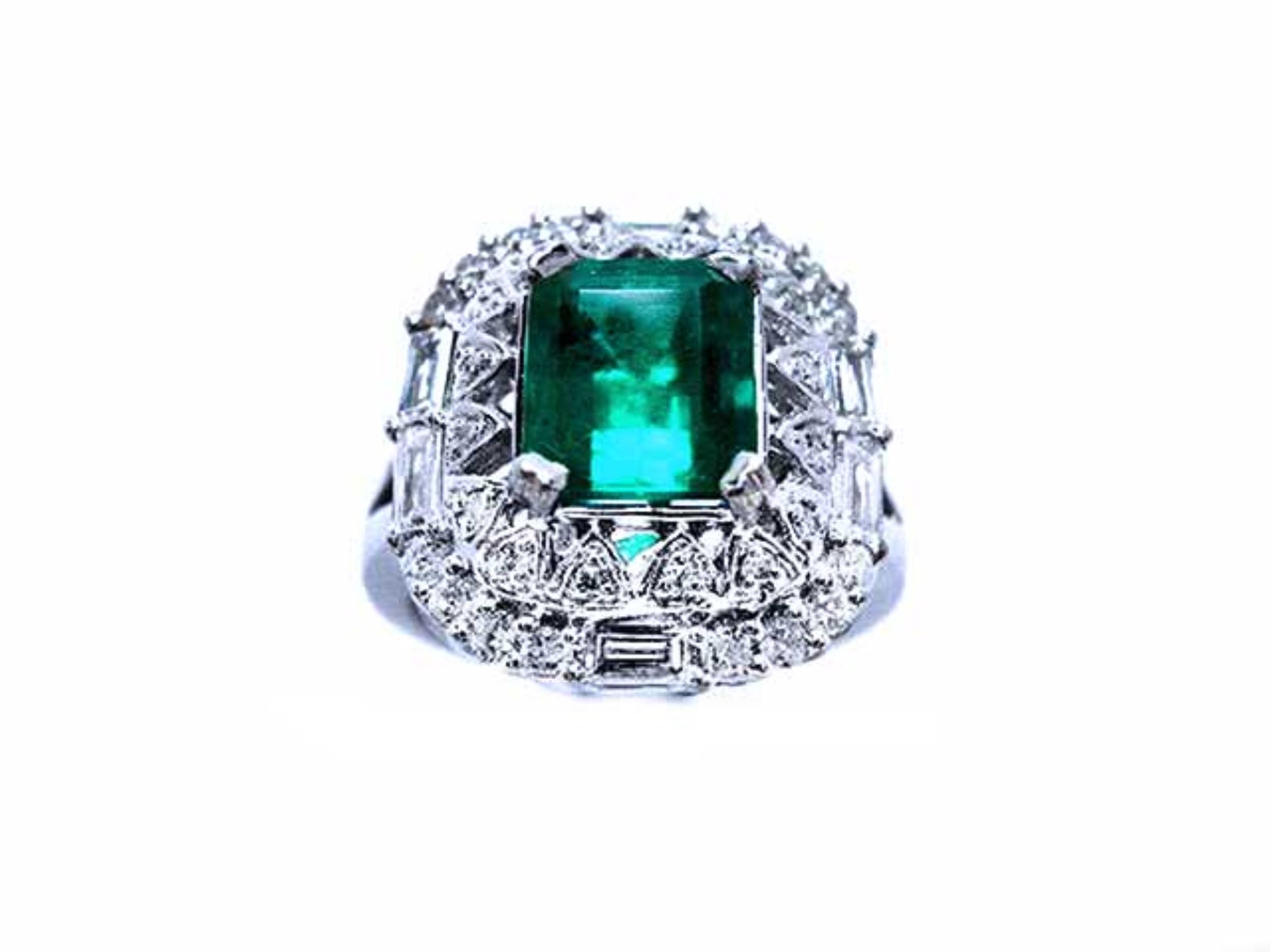 A vintage authentic Colombian emerald ring and accent diamonds in white gold.