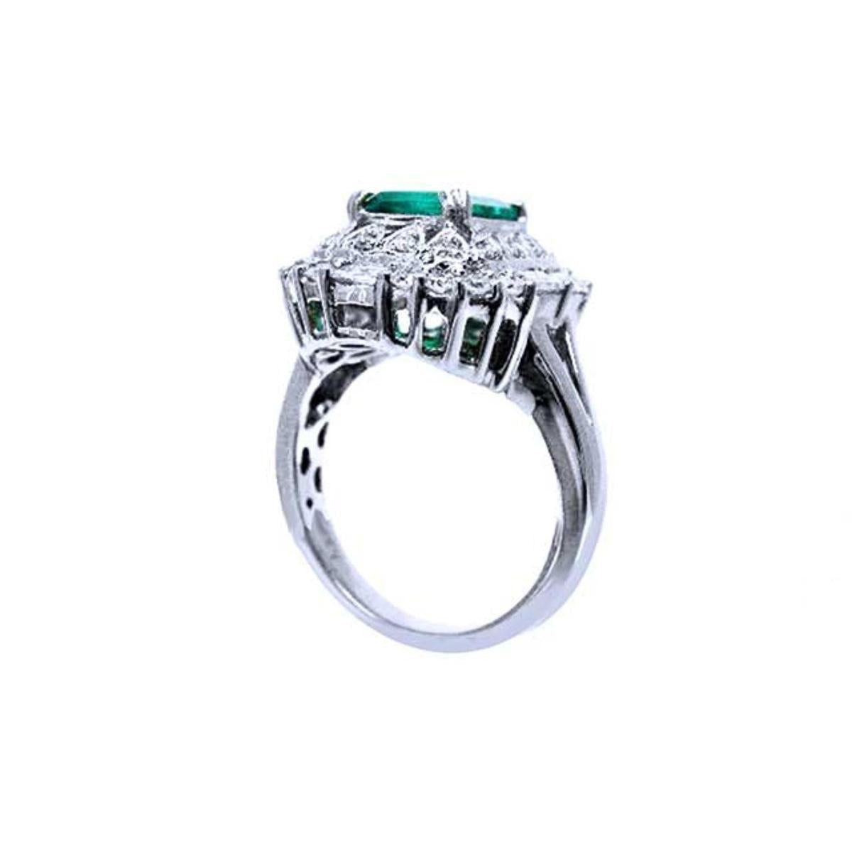 An underside view of this vintage emerald ring displaying the gallery and band ring