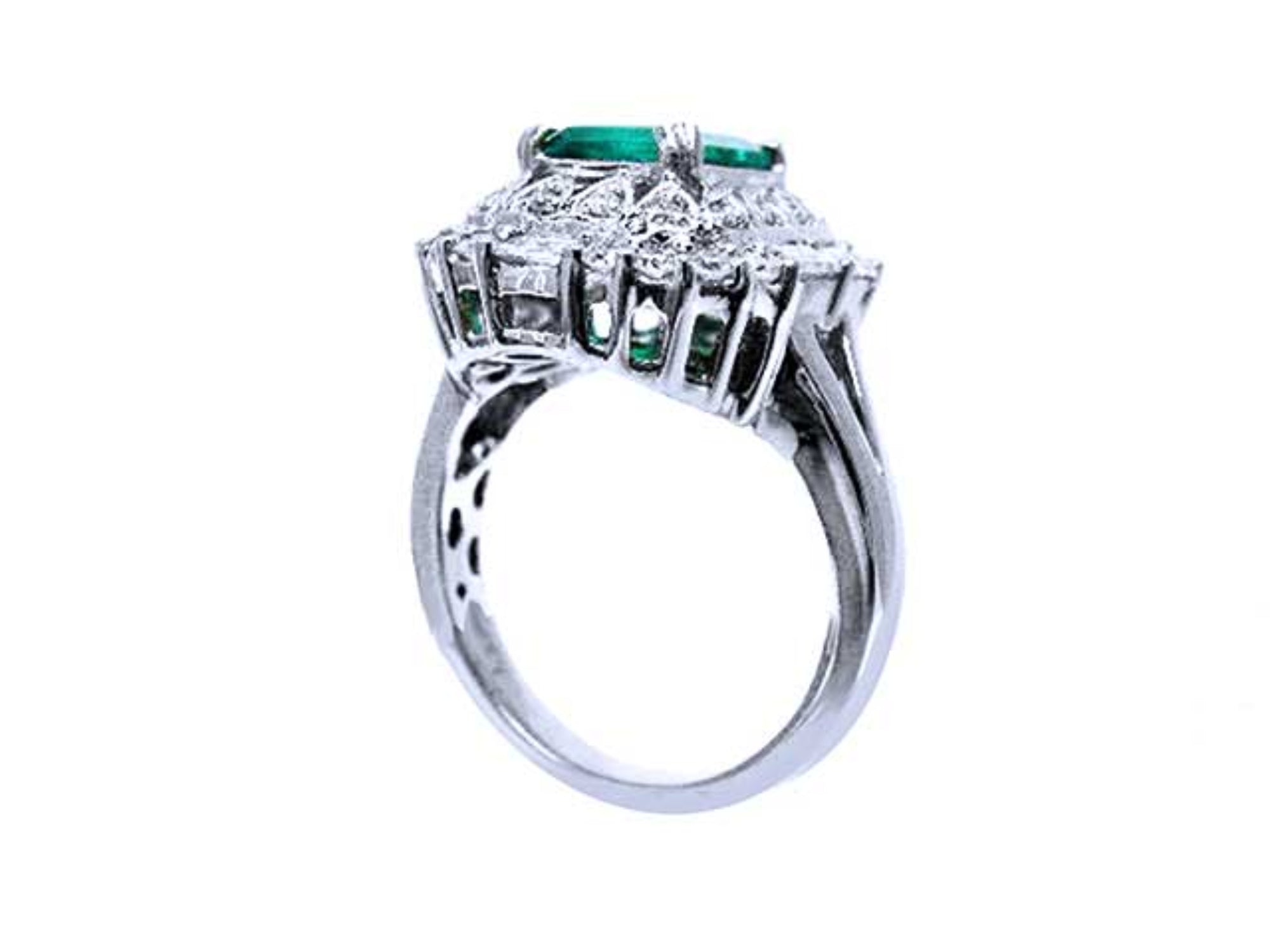 An underside view of this vintage emerald ring displaying the gallery and band ring