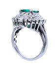 An underside view of this vintage emerald ring displaying the gallery and band ring