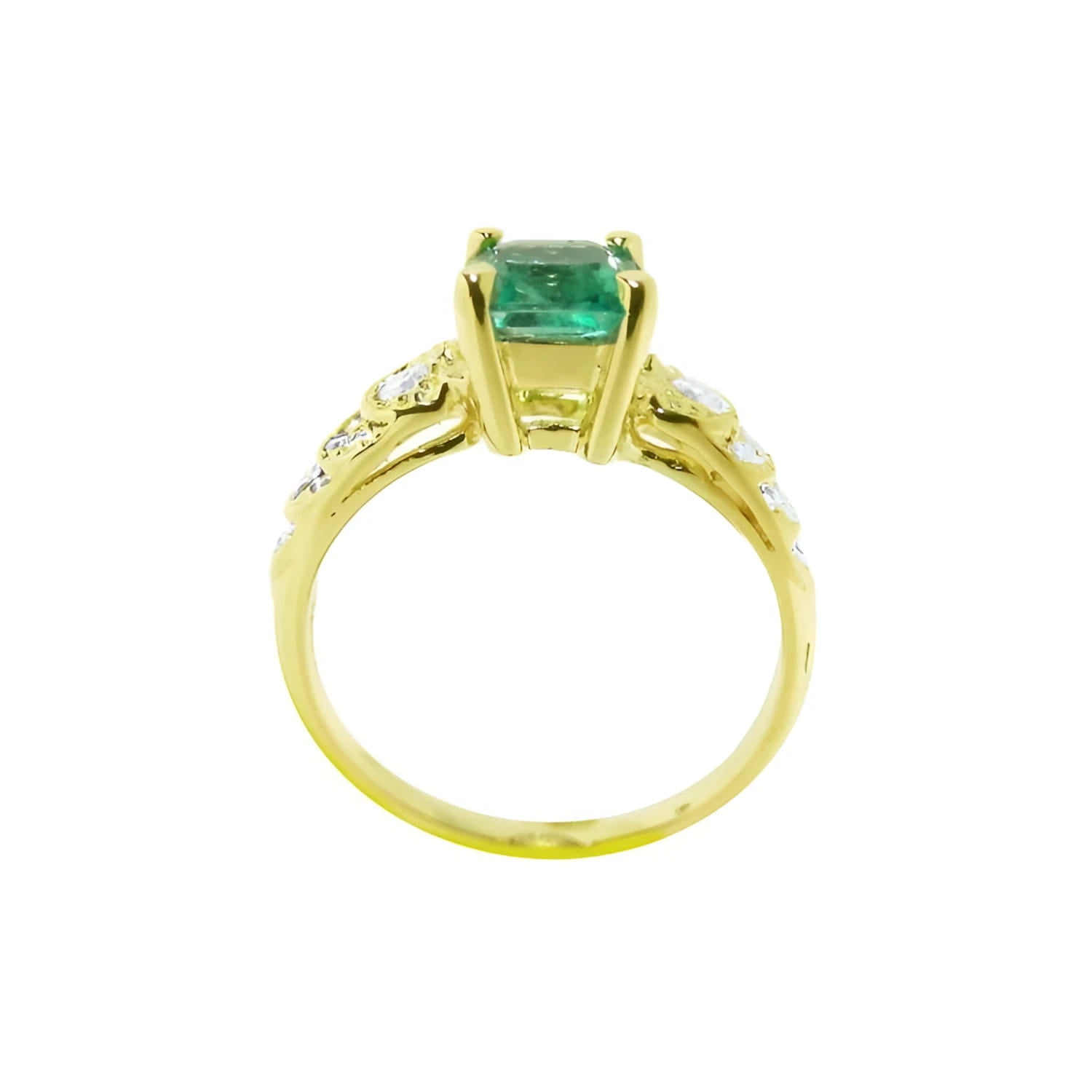 Vintage 14K yellow gold ring with a sparkling emerald cut Colombian emerald and accent diamonds.