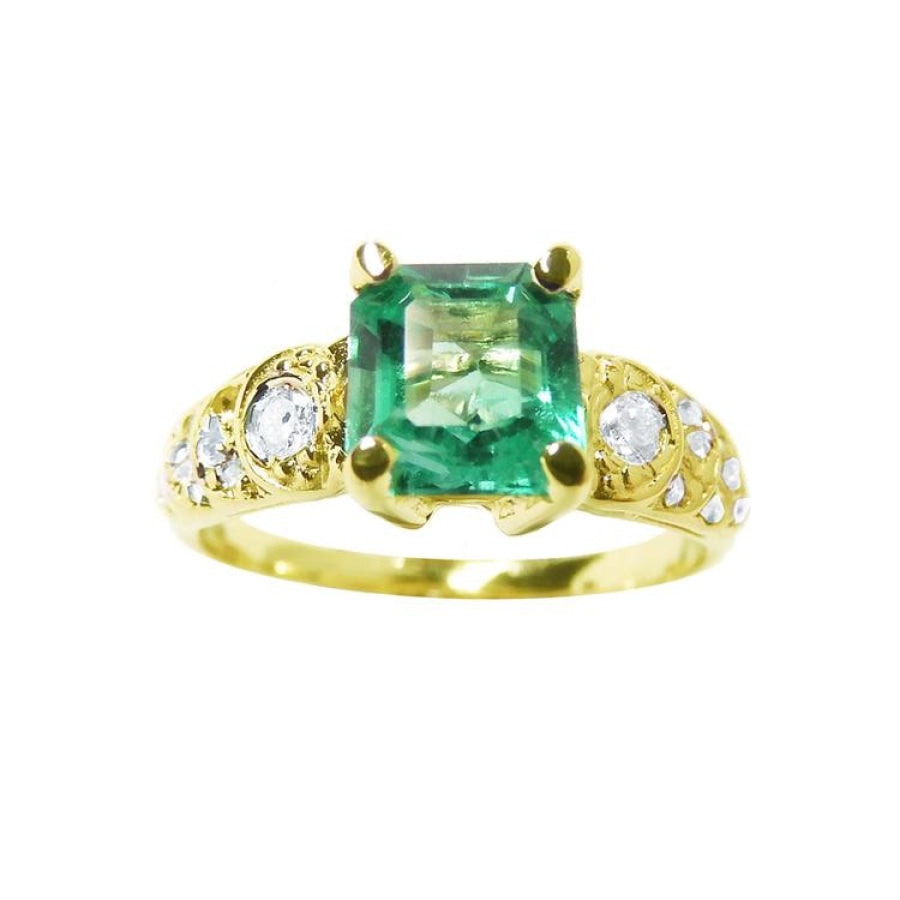 Vintage 14K yellow gold ring with a square emerald and round accent diamonds.