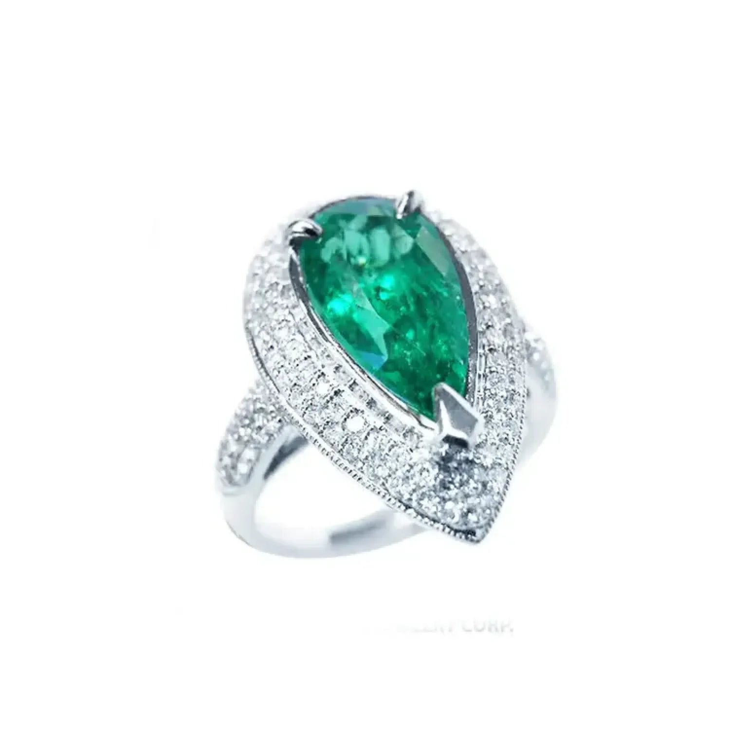 Anillo de oro blanco 14k con esmeralda colombiana corte pera 3.35 ct. rodeada de diamantes.