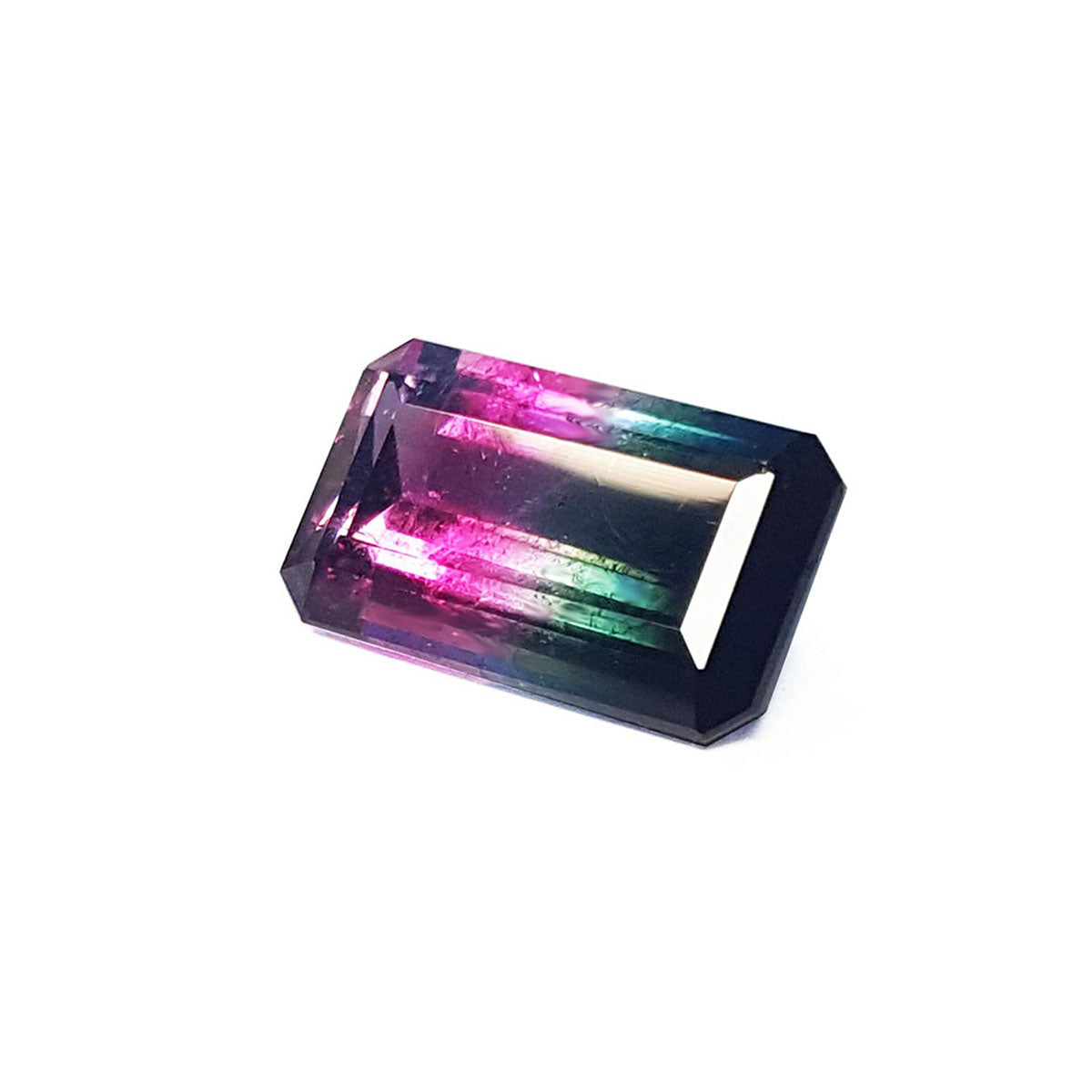 A natural watermelon tourmaline from Brazil in a rectangular shape emerald cut displaying the table and crown facets profile.