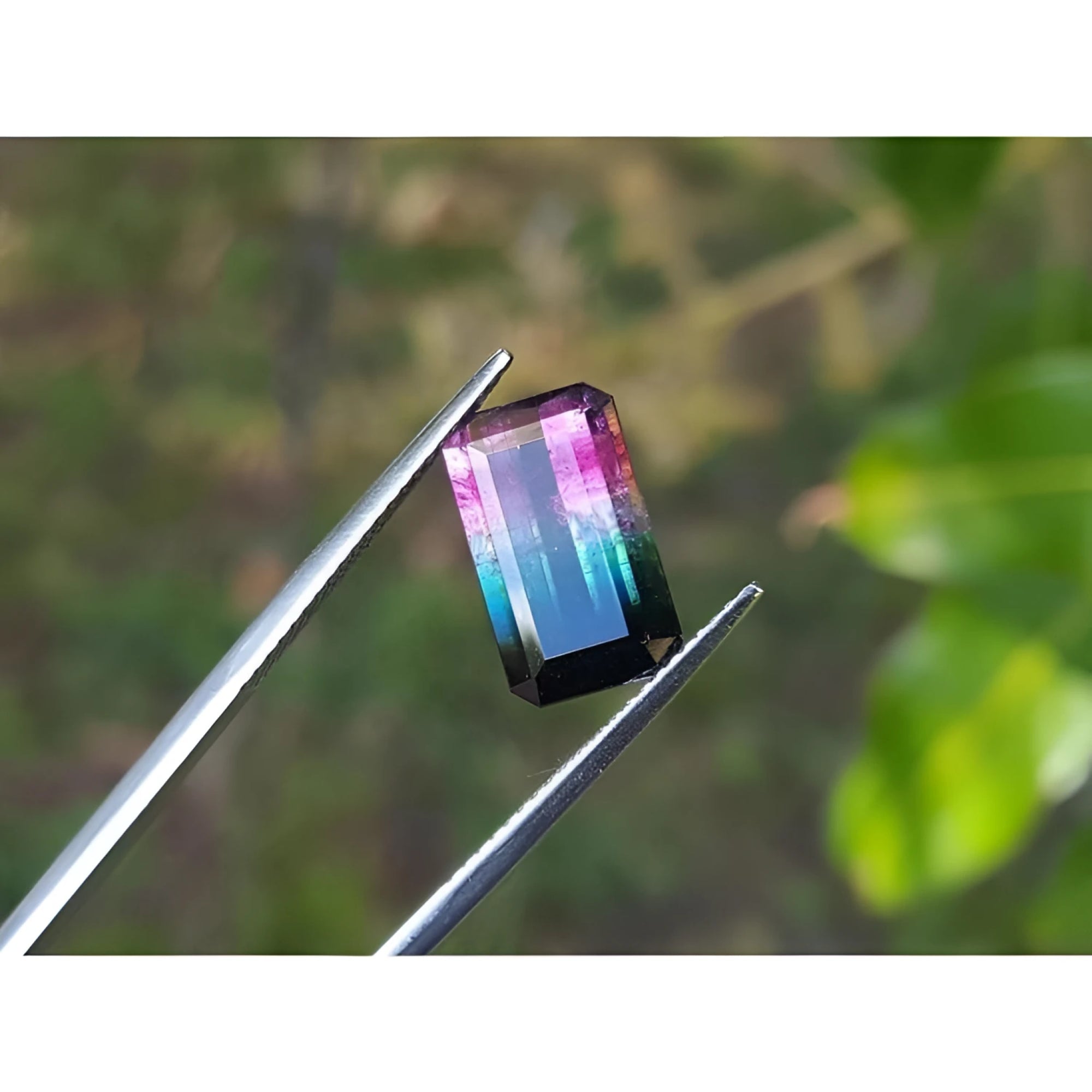 Brazilian bicolor watermelon tourmaline, 4.68 ct, with vibrant red-orange and deep bluish-green, emerald cut.
