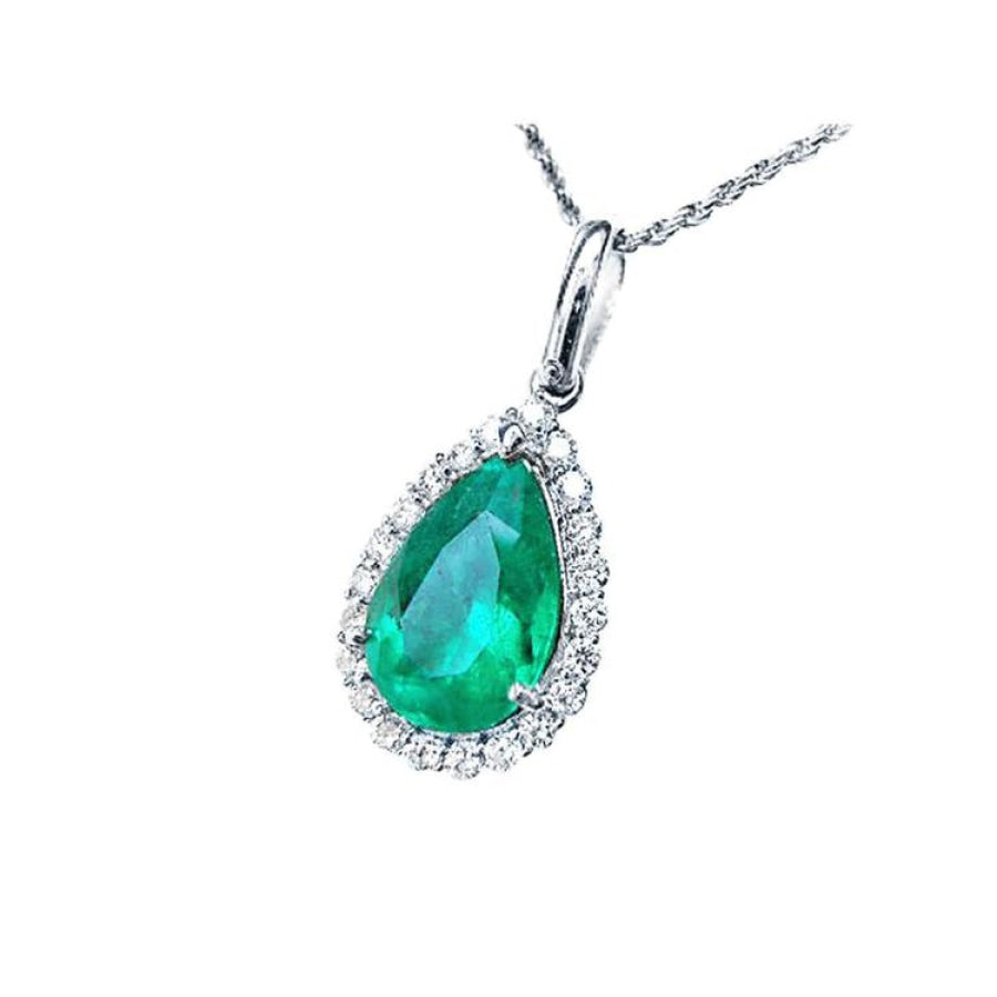 18K white gold pear-shaped emerald pendant with a halo of natural diamonds on a delicate chain.