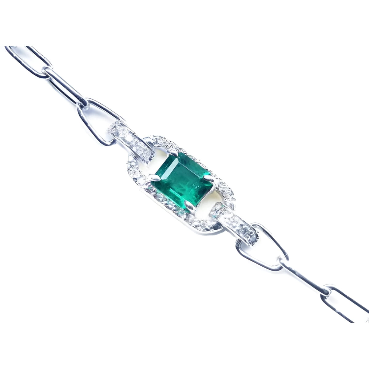 A 14k white gold paperclip bracelet with a natural colombian emerald and diamonds.
