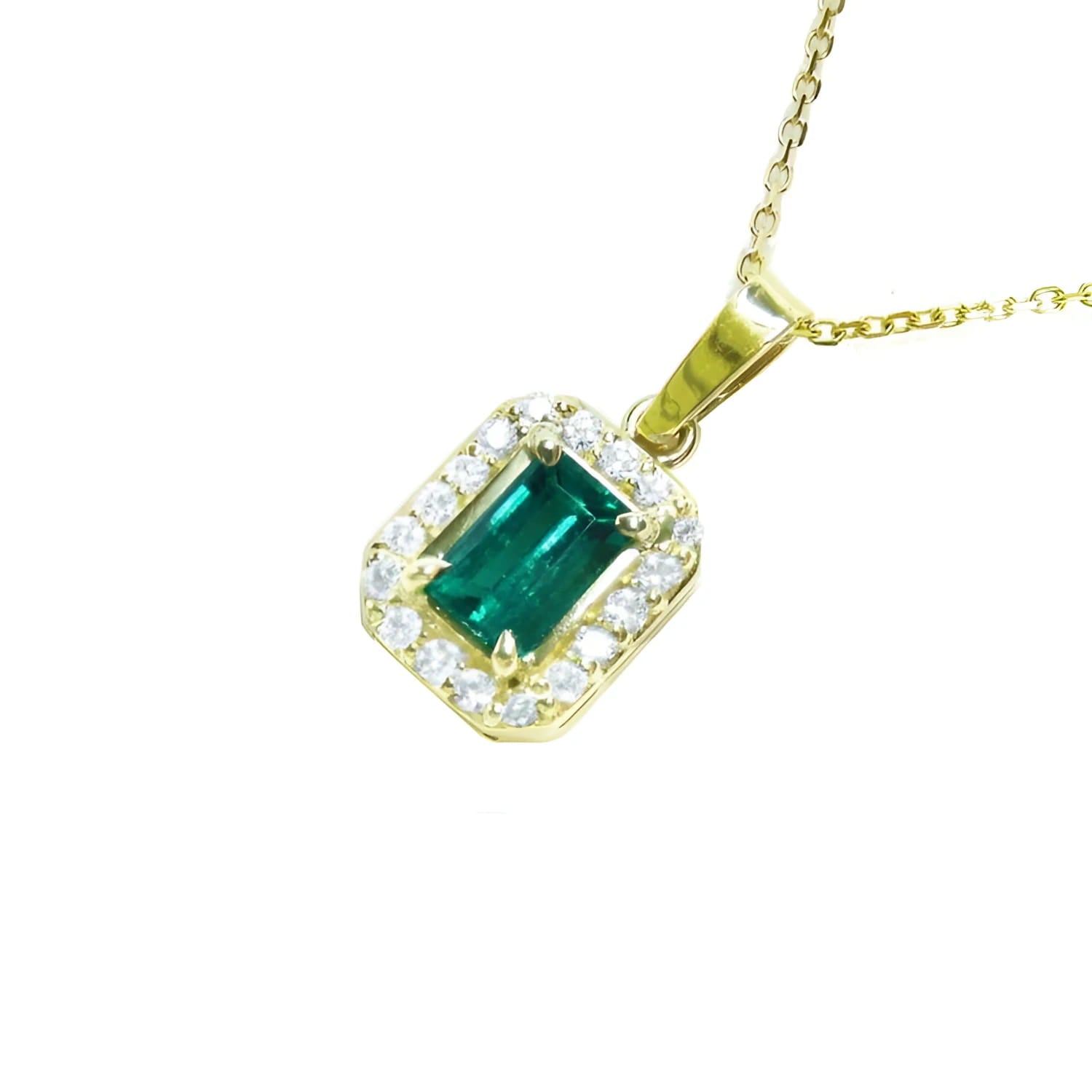 18k yellow gold pendant with a vibrant emerald-cut Colombian emerald and diamond halo.