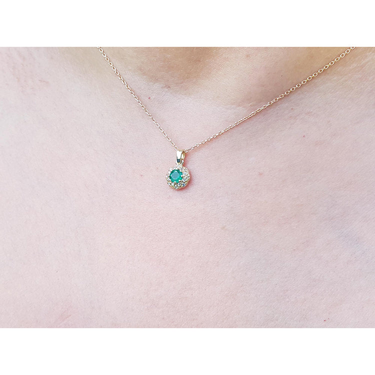 From the Muzo mines round cut emerald halo diamond minimalist necklace 14K yellow gold
