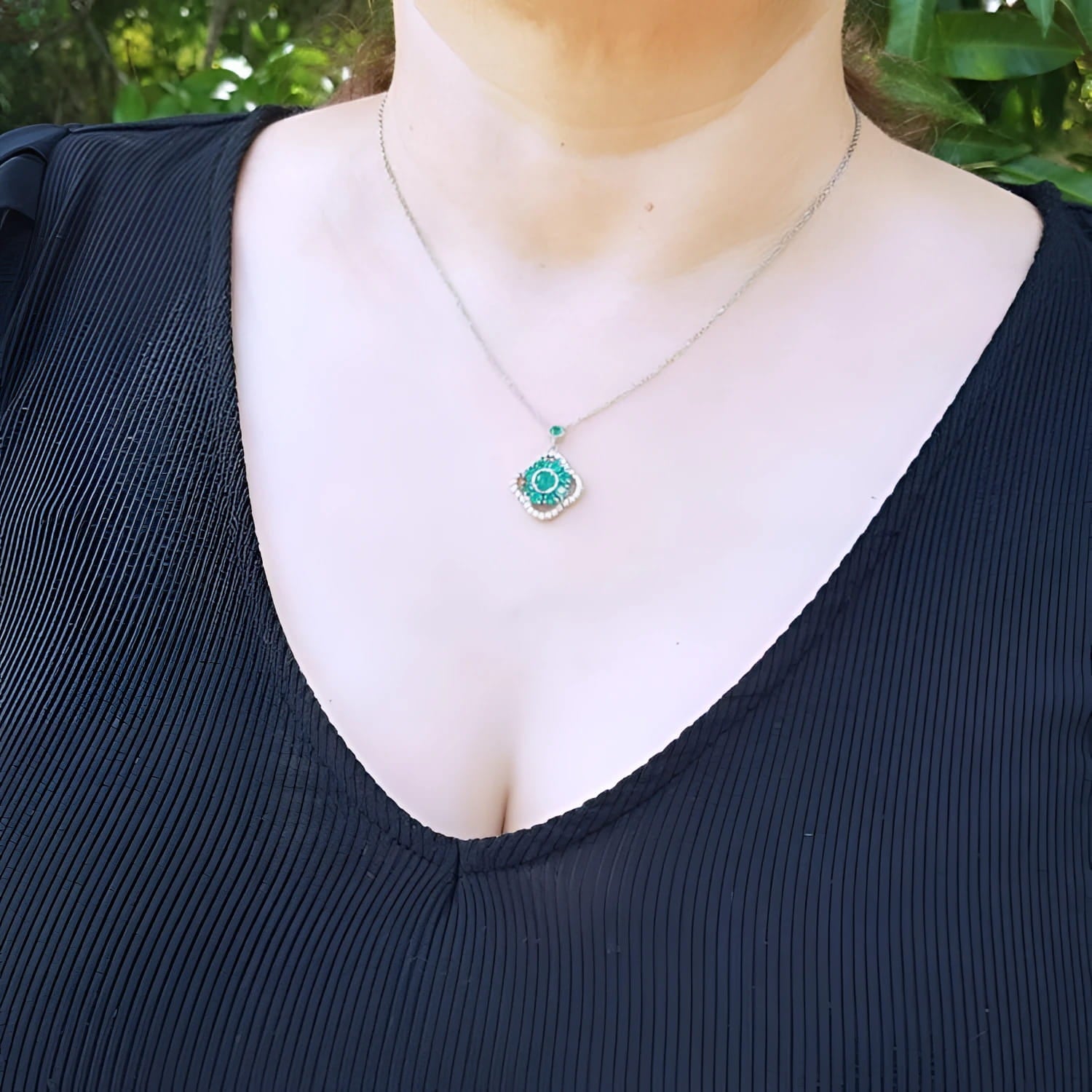 14K white gold cluster necklace with natural Colombian emeralds and diamonds in a 4-leaf clover design.