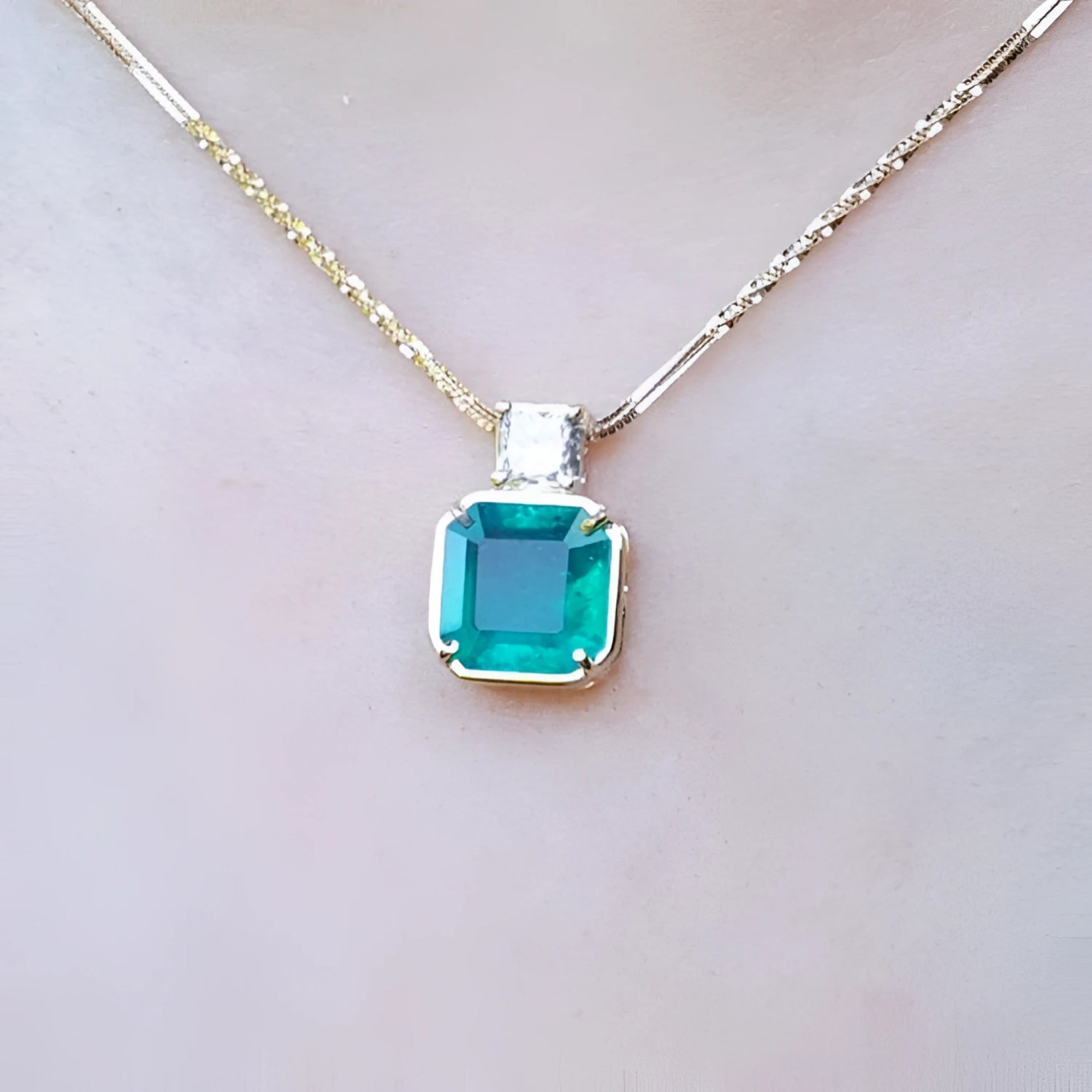 18k yellow gold necklace with an Asscher cut colombian emerald gemstone pendant top accent diamond.