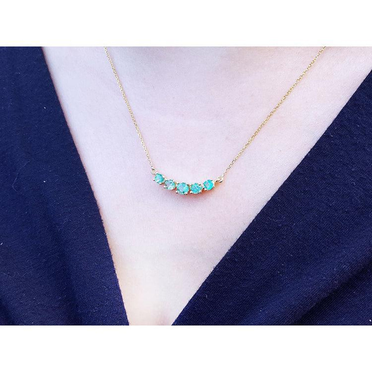 Sparkling Green Fire Emerald Necklace with five round cut emeralds on a 14K gold chain.