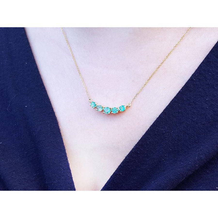 Sparkling Green Fire Emerald Necklace with five round cut emeralds on a 14K gold chain.