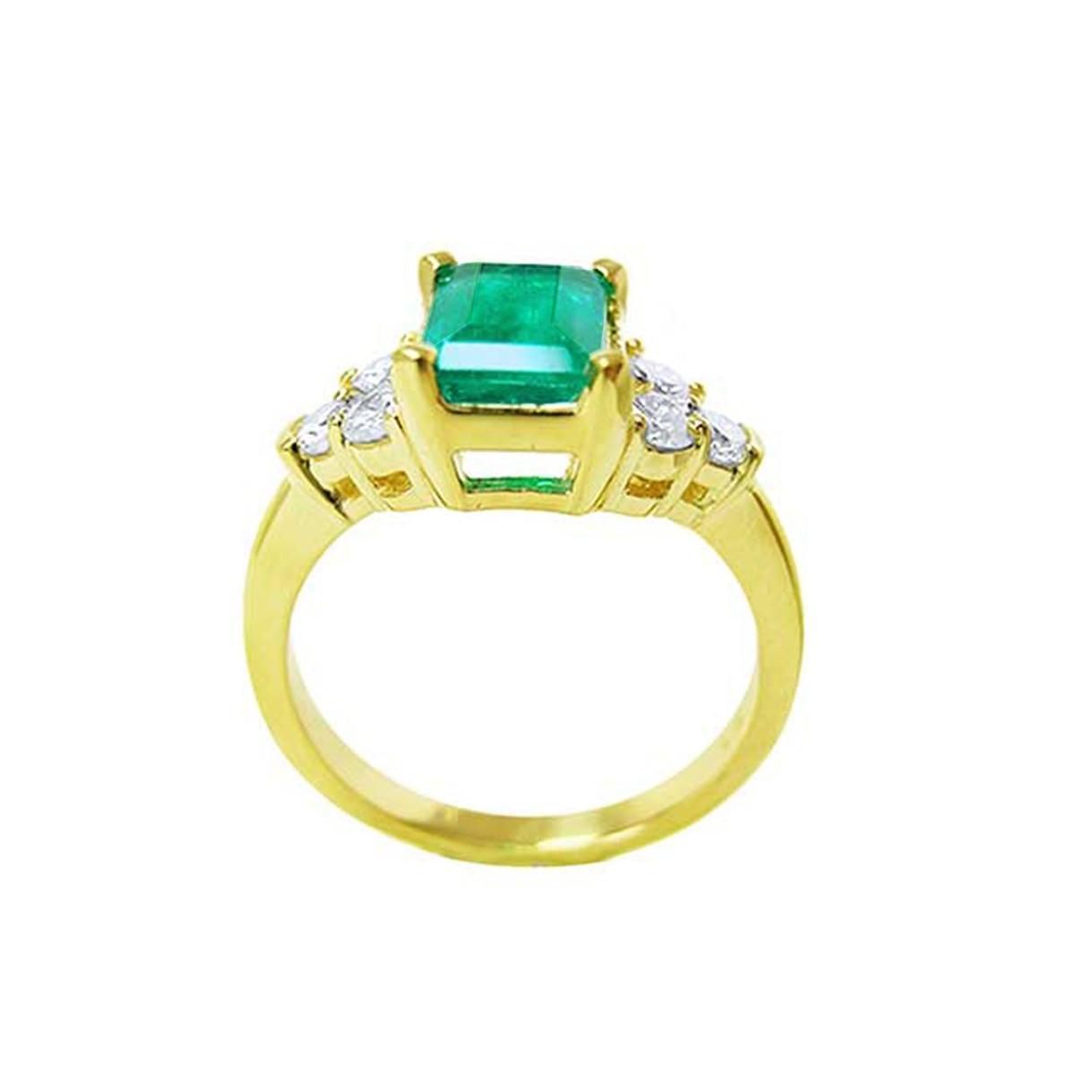 This image displays a yellow gold emerald and side diamond ring, displaying the top, gallery and band profile.