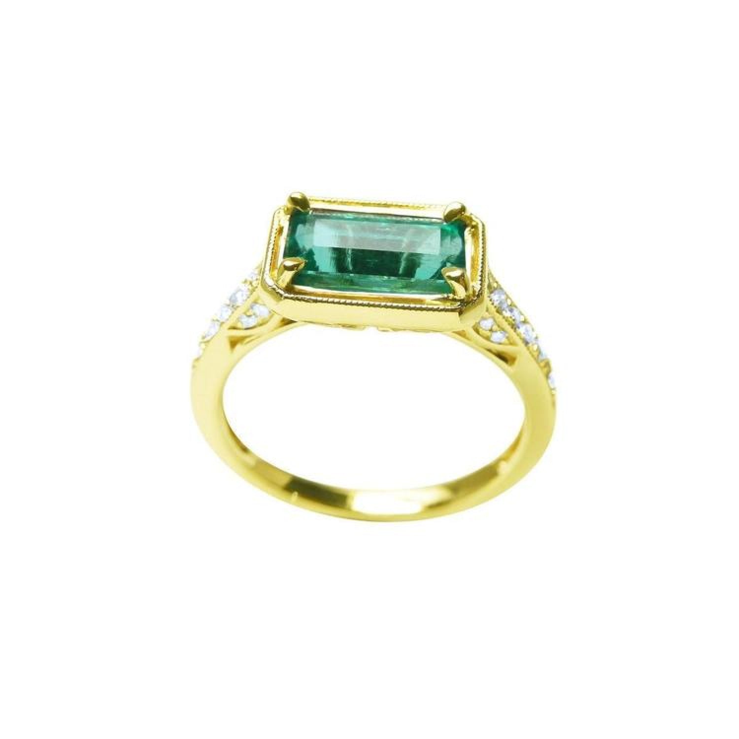1.30 carat emerald-cut natural Colombian emerald ring in 14K yellow gold, east-west style with diamond accents.