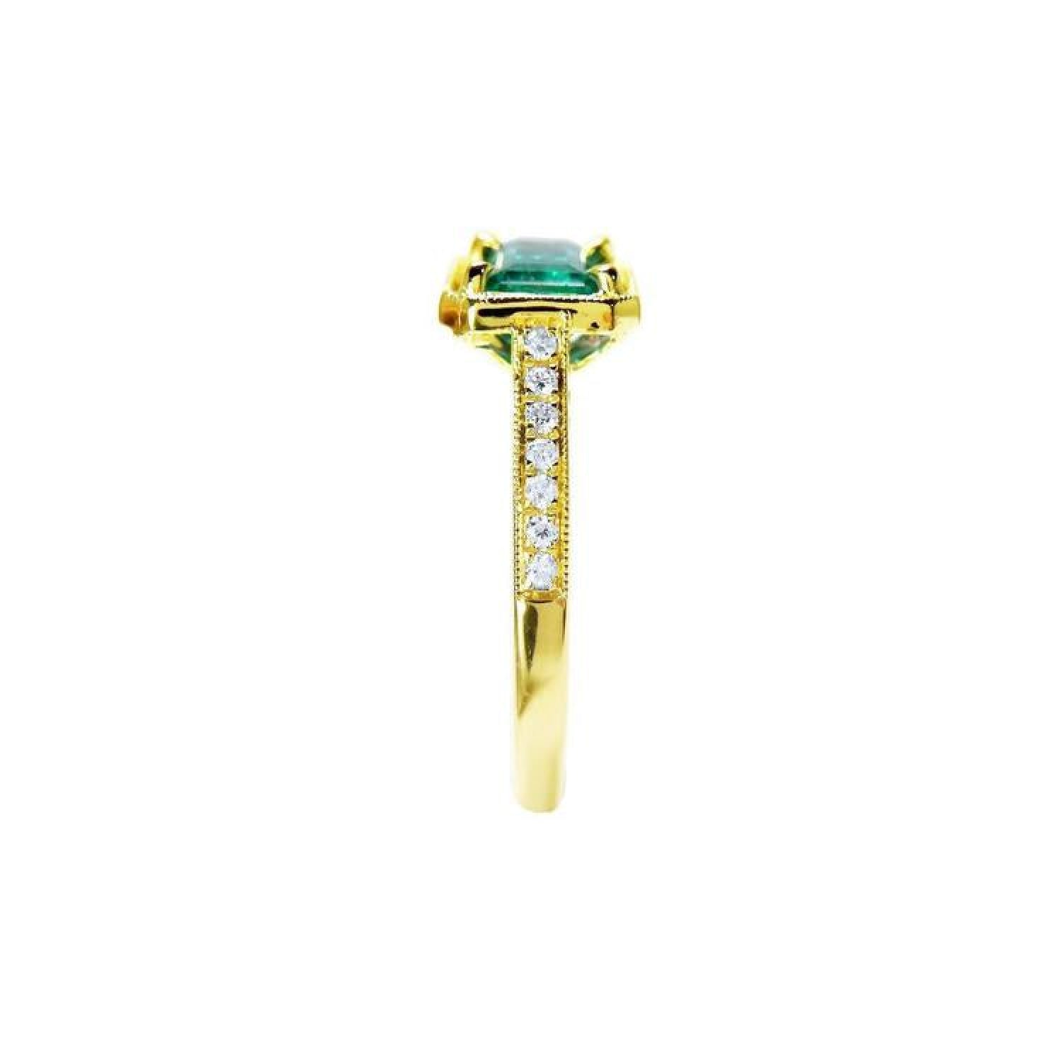 1.30 carat emerald-cut natural Colombian emerald ring in 14K yellow gold, east-west style with diamond accents.
