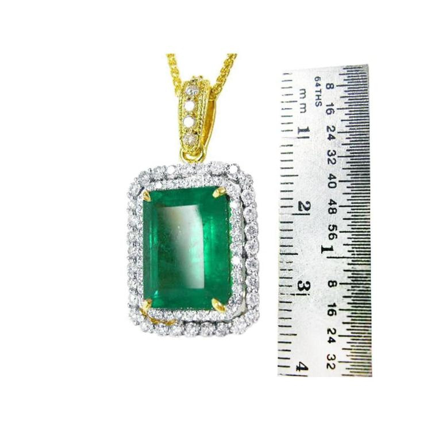 18K yellow gold emerald-cut pendant with a deep bluish-green emerald and double halo natural diamonds.