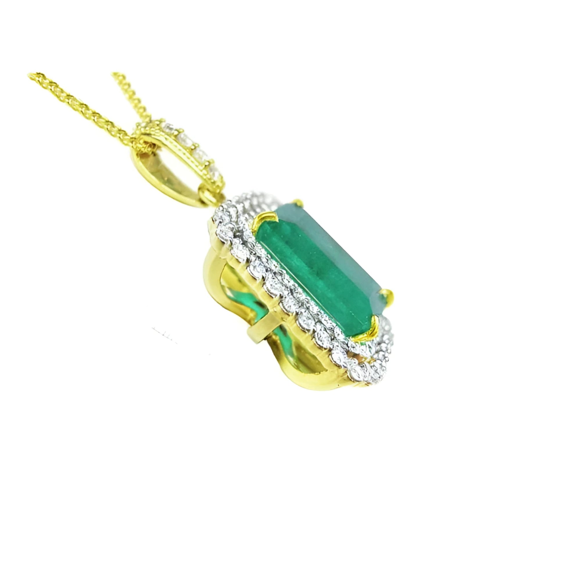 18K yellow gold emerald pendant with a rectangular emerald-cut stone and double halo natural diamonds.