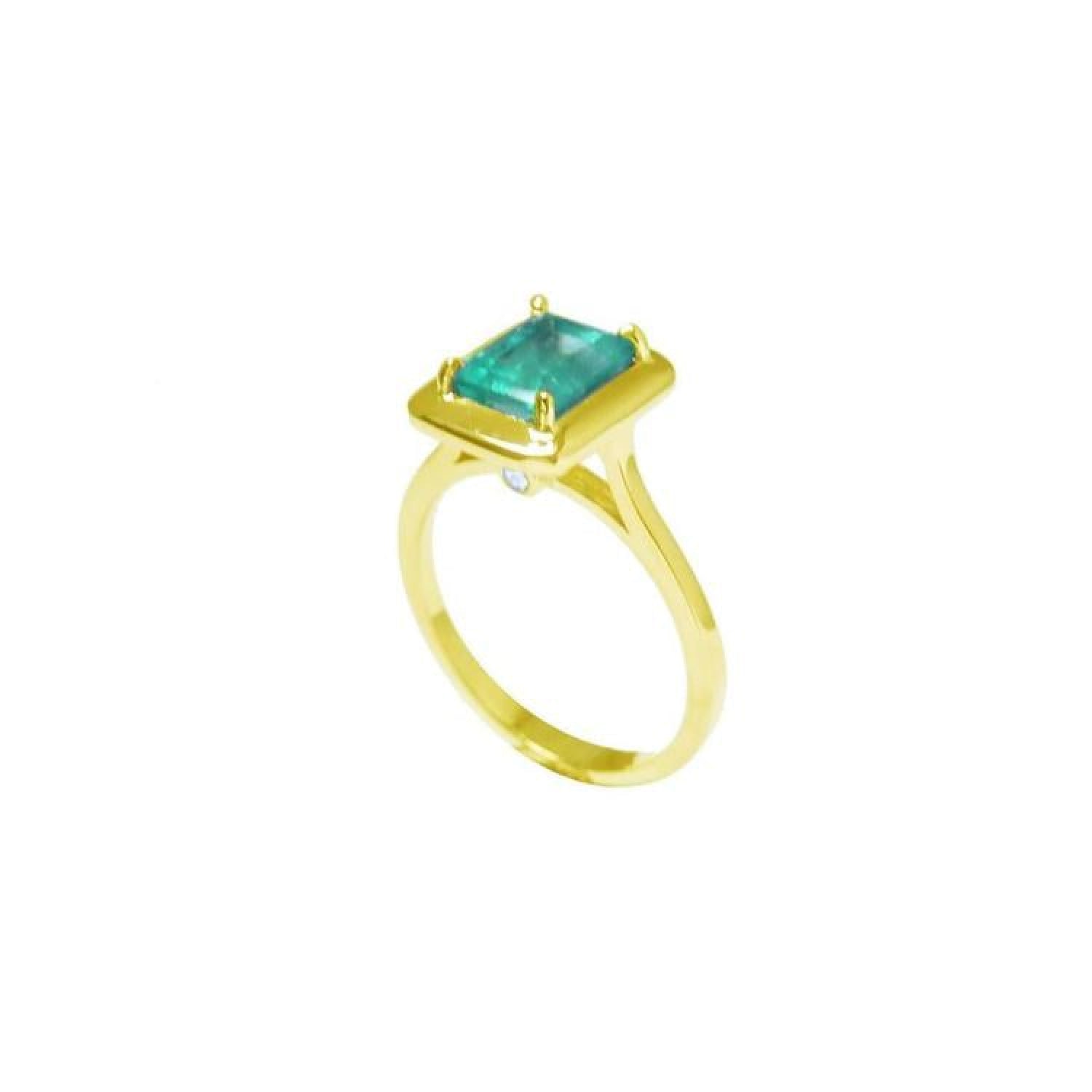 1.22 carat emerald-cut Muzo Colombian emerald solitaire ring in 14K yellow gold.