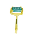 This emerald solitaire ring image shows the side of the gemstone and the band ring profile.
