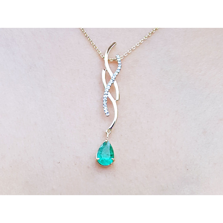 Colombian emerald necklace a 1.00 carat dangling pear cut emerald 14k yellow gold intertwined diamond design